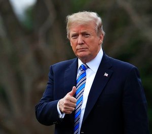 President Donald Trump gestures as he walks as he leaves the White House, Friday, Feb. 16, 2018, in Washington, for a trip to his private Mar-a-Lago resort in Florida.