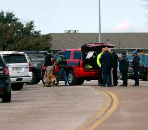 Authorities continue to work the scene of a fatal shooting where multiple people were shot at a church, Sunday, Dec. 29, 2019, in White Settlement, Texas.