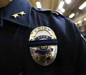 Brain McPike, chief of the University of Colorado-Colorado Springs police force, attends a vigil held on University of Colorado-Colorado Springs' campus Saturday, Nov. 28, 2015.