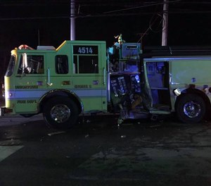 A Uniontown firefighter and a motorist were injured after a car struck and damaged a fire engine.