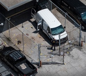 Evidence markers dot the pavement just outside the Wyandotte County courthouse, Friday, June 16, 2018, in Kansas City, Kan. (Photo/The Kansas City Star via AP)