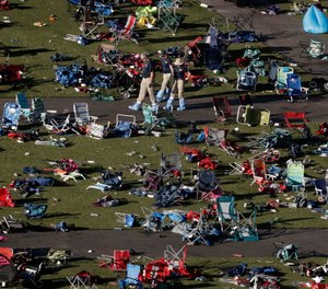 In this Oct. 4, 2017, file photo, agents from the FBI process evidence at the scene of a mass shooting in Las Vegas. (AP Photo/Gregory Bull, File)