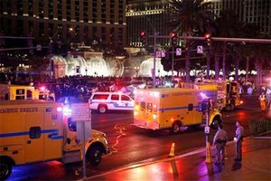 In this Dec. 20, 2015 file photo, police and emergency crews respond to the scene of an incident along Las Vegas Boulevard, in Las Vegas. Crime is spiking in Las Vegas and spurring questions about causes and cures. (AP Photo/John Locher, File)