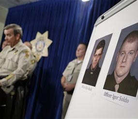 Sheriff Doug Gillespie, left, speaks at a news conference on the shooting of two Las Vegas Metropolitan Police Department officers Sunday, June 8, 2014 in Las Vegas. (AP Image)