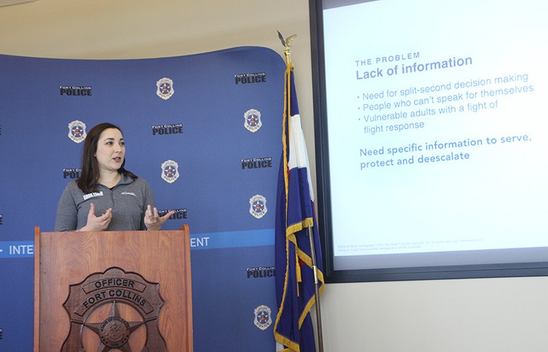 Stephanie Booco, co-responder program supervisor for UCHealth, discusses the need for the Vitals app to community members and reporters at a recent press conference announcing the use of the new technology.