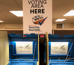 Voting booths stand ready in downtown Minneapolis on Thursday, Sept. 20, 2018, for the opening of early voting in Minnesota.