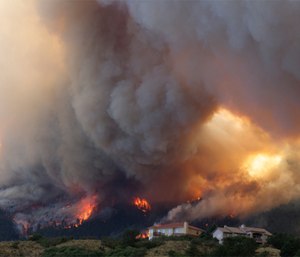 Fire from the Waldo Canyon wildfire burns as it moved into subdivisions and destroyed homes in Colorado Springs, Colo.