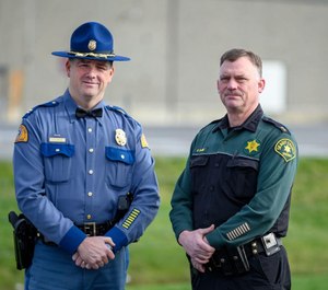 State Patrol Capt. Scott McCoy (left) and Skagit County Undersheriff Chad Clark stand near the section of Highway 20 they hope will be named after Trooper Thomas Hendrickson. (Photo/TNS)