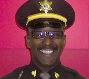 Wayne County Sheriff's Sgt. Lee Smith was struck by a black SUV and killed Tuesday, while jogging.