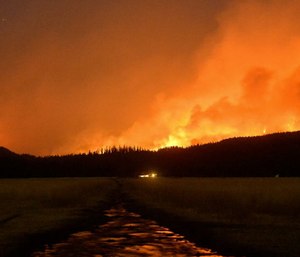 A group of paramedics are working to keep firefighters safe with their new approach of keeping close to them while they battle wildfires. (Photo/AP)