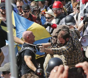 Violent clashes erupted at the rally between protesters and white nationalists. (Photo/AP)