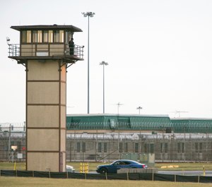 A CO stands on a tower during a hostage situation at James T. Vaughn Correctional Center in Smyrna, Del. One of three inmates on trial for a deadly Delaware prison riot was found guilty of murder Tuesday, Nov. 20, 2018, the first verdicts in a case that will involve 17 inmates over the next several months. (Suchat Pederson/The News Journal via AP, File)