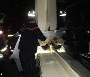 French gendarmes called to a robbery found the suspected thief stuck in a hole he'd made with a hammer in a shop window.