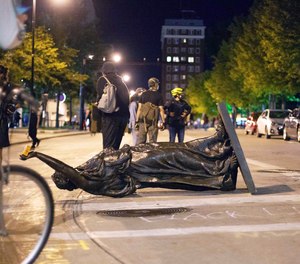 Demonstrators toppled a statue in Madison, Wisconsin June 23 after a night of violent protests.