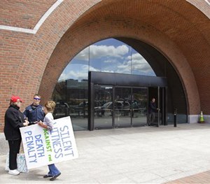 Anti-death penalty protestors outside the John Joseph Moakley United States Courthouse on Wednesday, May 13, 2015. (AP Image)