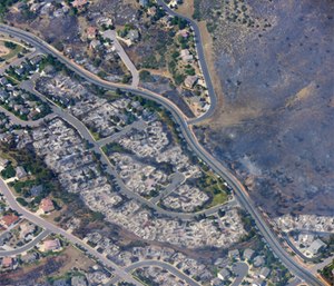 This aerial photo shows burned homes in the Mountain Shadows residential area of Colorado Springs, Colo., that were destroyed by the Waldo Canyon wildfire. (AP Photo/John Wark)