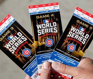 Chicago Cubs baseball fan Robert Lyons, who lives in Los Angeles and was raised in Berwyn, Ill., shows his World Series tickets outside Wrigley Field. (Michael Tercha/Chicago Tribune via AP)