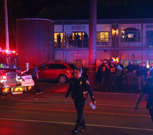 Investigators work the scene of a shooting at a yoga studio on Friday, Nov. 2, 2018, in Tallahassee, Fla.