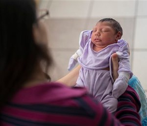 Cassiana Severino holds her daughter Melisa Vitoria, born with microcephaly at the IMIP hospital in Recife, Brazil.