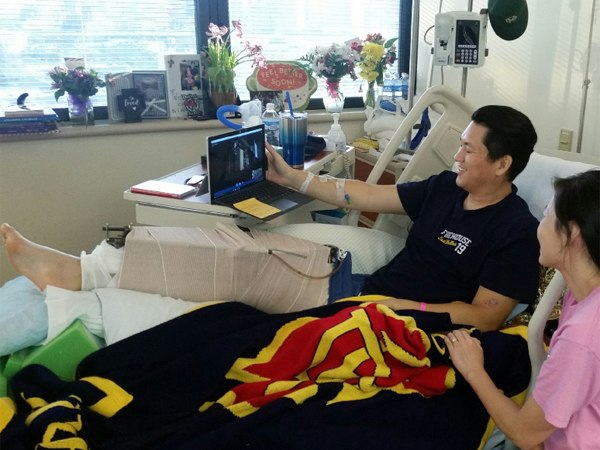 An and his wife viewing via Skype the special presentation to Dallas Police Department officers. (Photo/Dallas Fire-Rescue via Twitter)