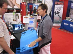 Photo Jamie Thompson Kathleen Kornaker, a Cleveland-based recovery room nurse who invented the BariBoard, displays the product at EMS Expo 2011.