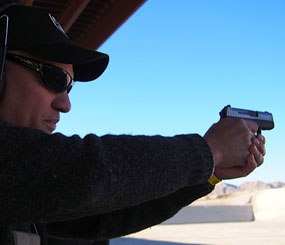 PoliceOne columnist Lindsey Bertomen tries out the new Sig Sauer P290RS at Media Day at the range to kick off SHOT Show 2014.