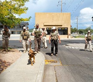 A team from Winslow’s Department of Corrections works through scenario training in Williams, Arizona.