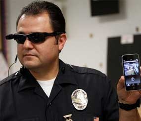 Los Angeles Police Sgt. Daniel Gomez demonstrating a video feed from his camera into his cellphone as on-body cameras are demonstrated for the media in Los Angeles.