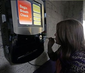 Zest's special events manager Lindsy Wing demonstrates their breathalyzer at Zest Kitchen & Bar Friday, Feb. 14, 2014, in Salt Lake City.