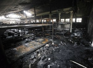 In this Tuesday Aug. 11, 2009 file photo, dozens of burned-out bunks are seen in a dormitory damaged by fire, during a tour of the California Institution for Men in Chino, Calif.