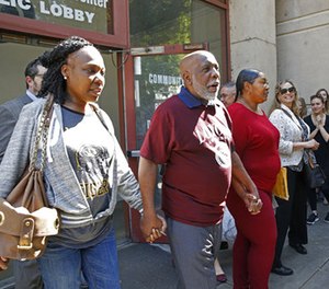 Andrew Wilson, second from left, is accompanied by his daughters, Catrina Burks, far left, and Gwen Wilson, third from left, as he leaves the Men's Central Jail in Los Angeles, Thursday, March 16, 2017.