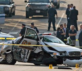 A damaged Capitol Hill police care is surrounded by crime scene tape after a car chase and shooting on Capitol Hill in Washington, Thursday.
