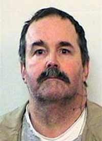 Convicted killer Charles Smith, one of three inmates who escaped from the Indiana State Prison Sunday night, who was caught Monday near the vacation home of Chicago Mayor Richard Daley by one of his bodyguards. (AP photo)