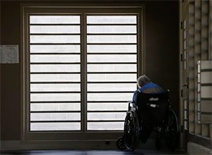 In this July 24, 2014 file photo, an inmate sits by a window at the mental health unit at the California Department of Corrections and Rehabilitation's Stockton Health Facility in Stockton, Calif. (AP Photo/Rich Pedroncelli, file)
