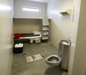 This Sept. 2, 2015 photo shows the the door to the cell at Hampton Roads Regional Jail in Portsmouth, Va., where 24-year-old Jamycheal Mitchell was found dead Aug. 19, 2015. (Bill Tiernan/The Virginian-Pilot via AP)