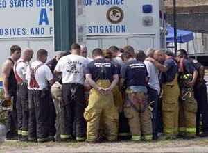 AP Photo/Stephen MortonFirefighters from Charleston and surrounding areas pause for a moment of prayer in front of the rubble of the Sofa Super Store on Tuesday, June 19, 2007.