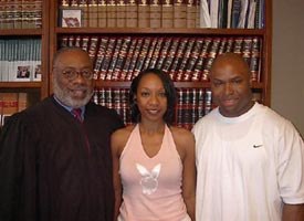 This photo shows Maurice Clemmons, right, his wife Nicole Smith, center and Judge Marion Humphrey after the couple was married in the summer of 2004. (AP photo/Pulaski County Circuit Court)
