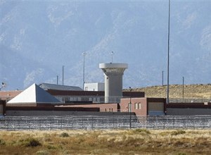 This Thursday, Oct. 15, 2015 file photo shows a guard tower looming over a federal prison complex which houses a Supermax facility outside Florence, in southern Colorado. (AP Photo/Brennan Linsley,File)