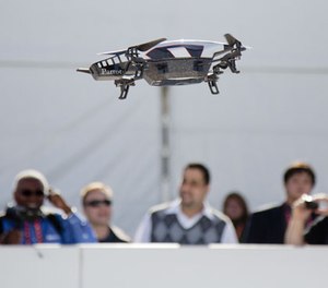 A Parrot AR Drone 2.0 is seen flying during a demonstration at the Consumer Electronics Show, Wednesday, Jan. 9, 2013, in Las Vegas.