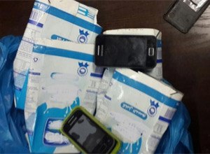Qibbeh prison guards find phones hidden inside milk cartons. (Photo Internal Security Forces' Twitter page)