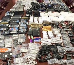 In this photo made available by the South Carolina Department of Corrections on Wednesday, April 6, 2016, shows cell phones that were seized in a single raid from the Lee Correctional Institution, S.C.