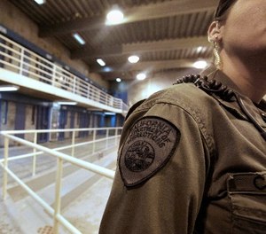 This Aug. 17, 2011 file photo shows a correctional officer in one of the housing units at Pelican Bay State Prison near Crescent City, Calif.
