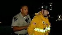 Firefighter handcuffed by officer at freeway crash files claim
