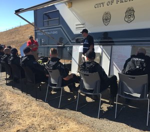 SWAT officers review the safety priorities before a training exercise.