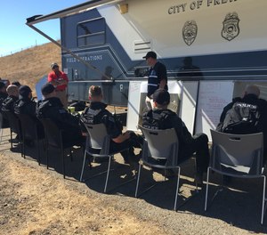 SWAT officers review the safety priorities before a training exercise.
