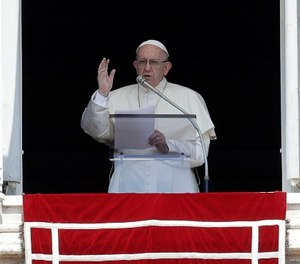 In this Aug. 5, 2018, file photo Pope Francis delivers a blessing from his studio window overlooking St. Peter's Square at the Vatican. (AP Photo/Gregorio Borgia File)