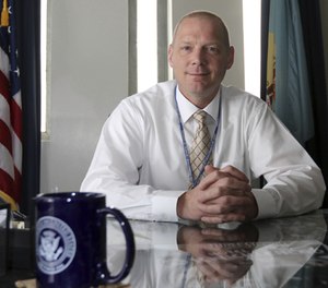 In an April 6, 2016 photo, David Pierce, warden for James T. Vaughn Correctional Center, poses for a photo in his office in Smyrna, Del. (Jennifer Corbett/The Wilmington News-Journal via AP)