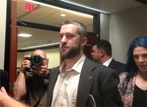 Television actor Dustin Diamond, center, leaves court in Port Washington, Wisc., after being convicted of two misdemeanors stemming from a barroom fight on Christmas Day 2014.