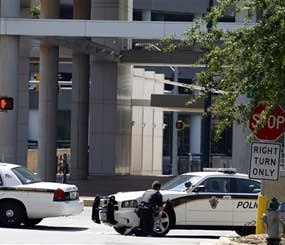 A man upset with the Discovery Channel network's programming took three people hostage at the company's headquarters. All three hostages escaped safely, but the gunman left the building on a slab.