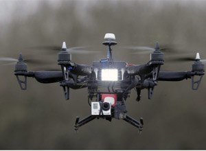 A drone carrying a video camera being demonstrated in France. The now-common flying devices have in some instances been used to lower contraband into outdoor areas within correctional facilities.